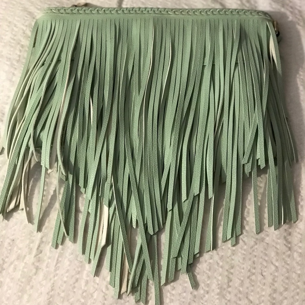 Faux leather fringe clutch.